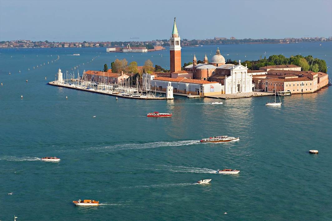 Aerial view of San Giorgio Maggiore island and bell tower in the Venice lagoon
